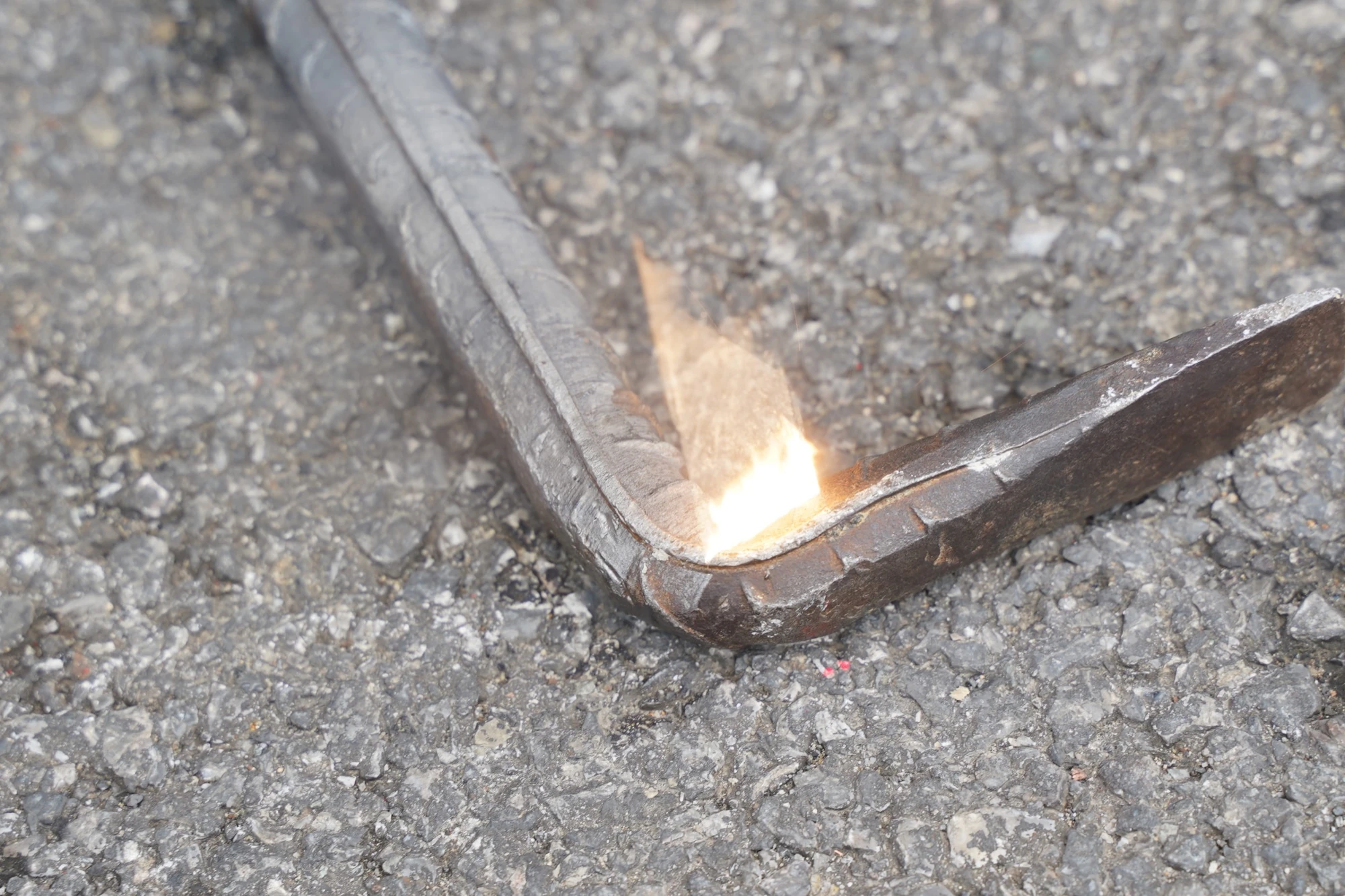 Pulsed laser stripping oxide and surface rust from a fabricated steel part